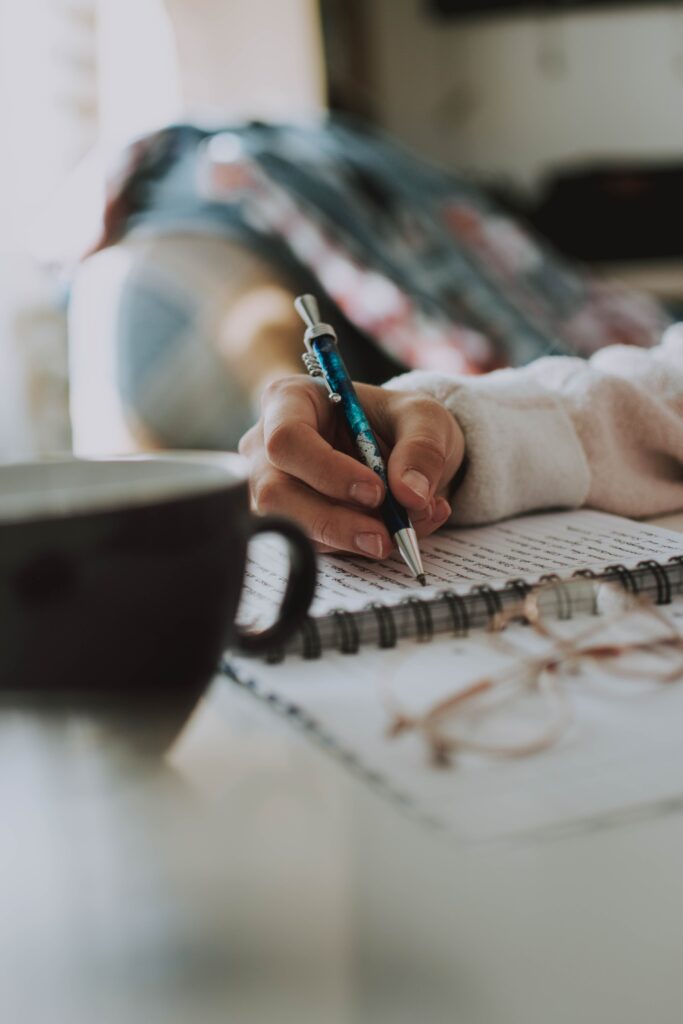 woman writing in journal